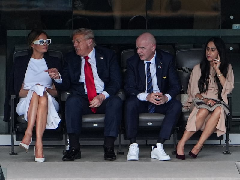 President Donald Trump seated with First Lady Melania Trump, FIFA President Gianni Infantino, and his wife Leena Al Ashqar at the FIFA Club World Cup 2025 Final match on July 13, 2025 in New Jersey.
