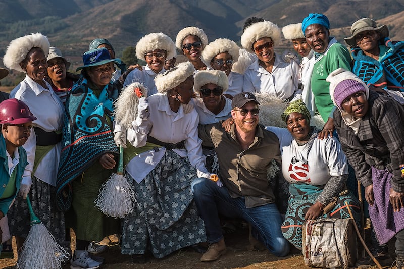 Prince Harry, Duke of Sussex poses for a photo with members of the community during a visit to Matlameng – Ha Mahlehle in the Leribe region with Sentebale to meet with the community and see the climate resilience project in action on Oct. 2, 2024 in Leribe, Lesotho.
