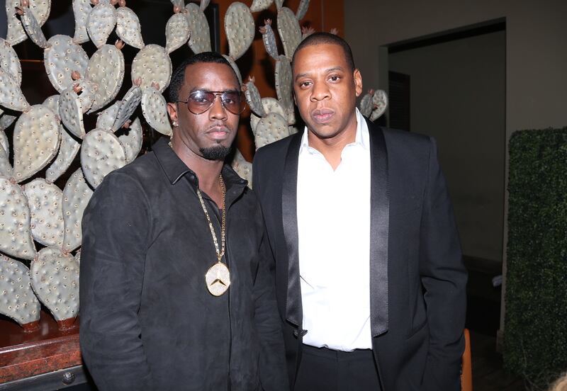 Sean "Diddy" Combs and Jay-Z attend The Two Kings Dinner presented by Sprite at RDG + Bar Annie on February 16, 2013 in Houston, Texas.