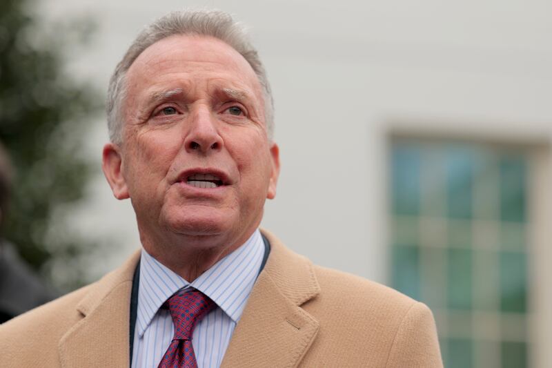 Wearing a striped shirt, blue and red tie, and tan overcoat, Steve Witkoff, special envoy to the Middle East, speaks to the press outside of the White House in March.