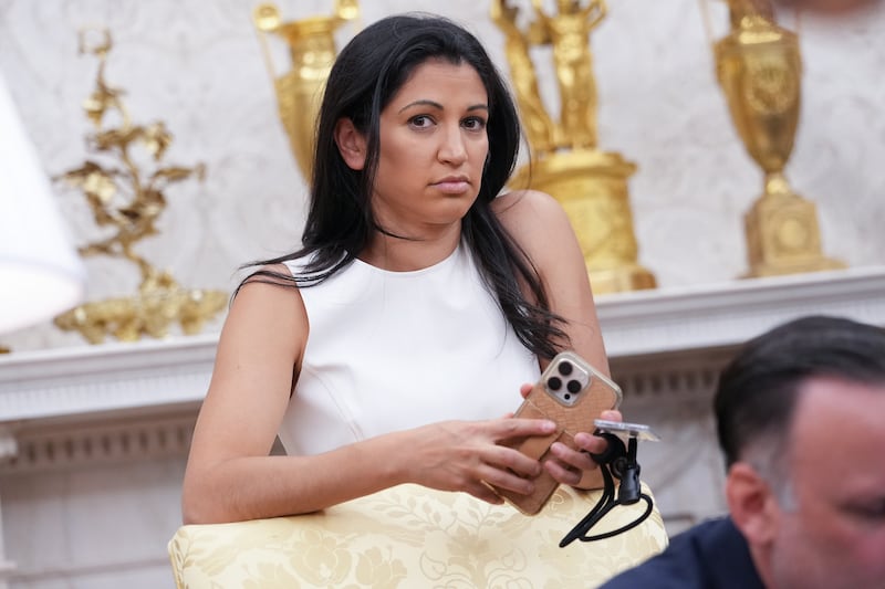 Katie Miller listens as Donald Trump and speak to reporters in the Oval Office of the White House on May 30, 2025 in Washington, DC.