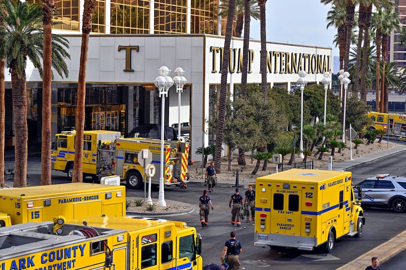 Clark County fire vehicles surround the valet area where a Cybertruck caught fire at the Trump International Hotel.