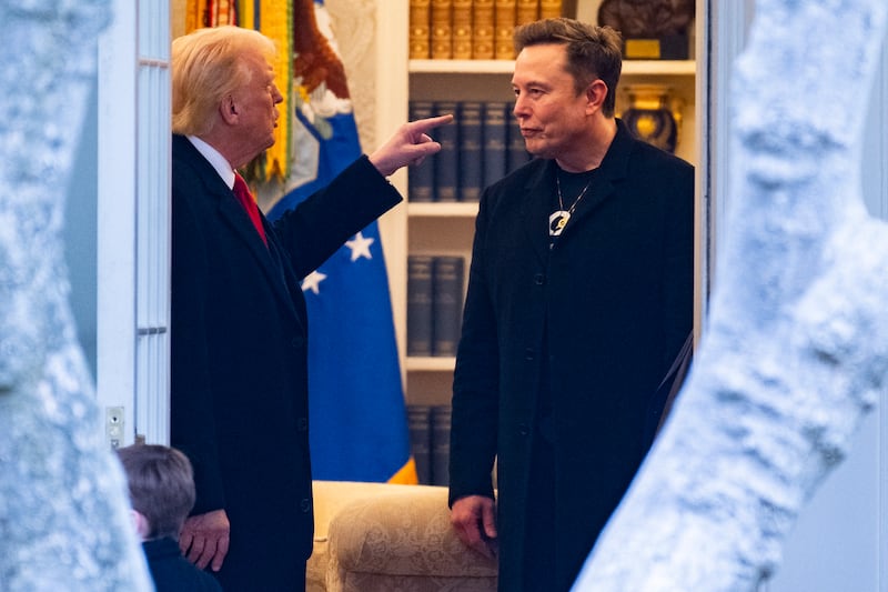 TOPSHOT - US President Donald Trump and Elon Musk (R) speak before departing the White House on his way to his South Florida home in Mar-a-Lago in Florida on March 14, 2025. Trump is spending the weekend at his Florida Mar-a-Lago resort.