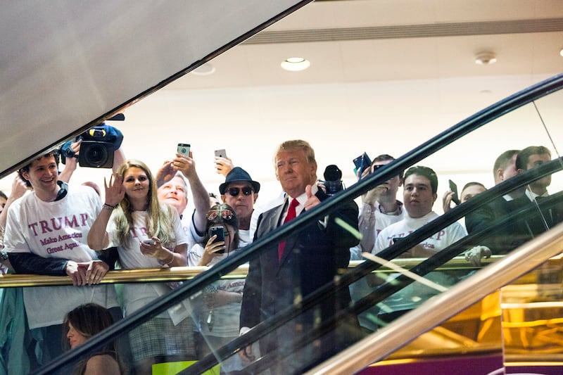 Donald Trump rides an escalator to a press event announcing his candidacy for the U.S. presidency at Trump Tower on June 16, 2015 in New York City.