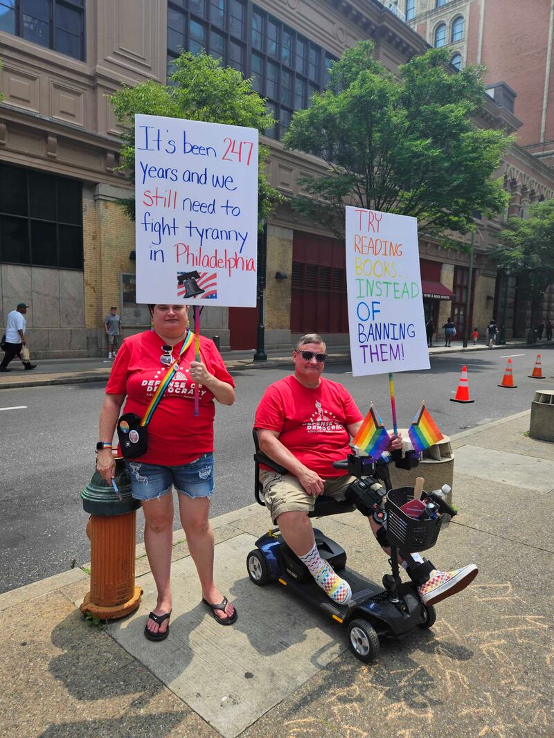 Protesters turned out in opposition to Moms For Liberty’s book bans and the group’s anti-LGBTQ agenda.