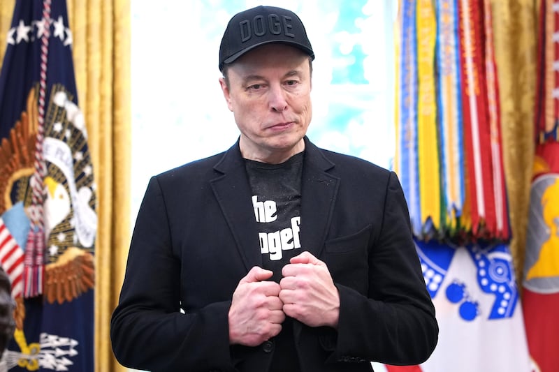 Elon Musk listens as U.S. President Donald Trump speaks to reporters in the Oval Office of the White House on May 30, 2025 in Washington, D.C.