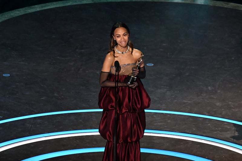 US actress Zoe Saldana accepts the award for Best Actress in a Supporting Role for "Emilia Perez" onstage during the 97th Annual Academy Awards at the Dolby Theatre in Hollywood, California on March 2, 2025.