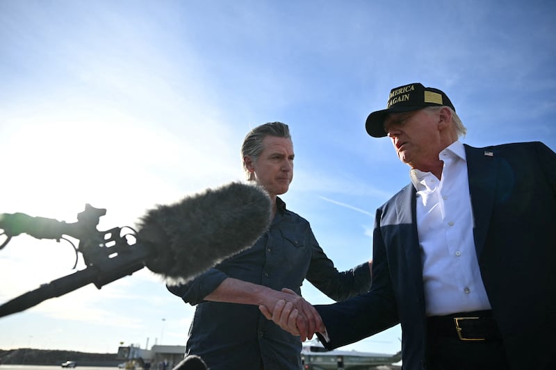 President Donald Trump shakes hands with California Gov. Gavin Newsom upon arrival at Los Angeles International Airport on January 24, 2025, to visit the region devastated by the Palisades and Eaton fires.