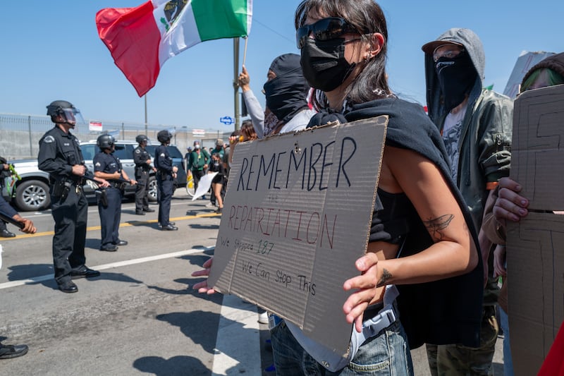 Protesters gather outside of a federal building following raids by Immigration and Customs Enforcement (ICE) that began last Friday, on June 10, 2025 in Los Angeles, California.