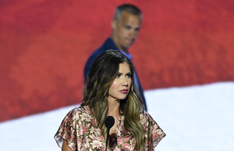 South Dakota Republican Governor Kristi Noem takes part in a sound check as political commentator Corey Lewandowski looks on at the Fiserv Forum ahead of the 2024 Republican National Convention on July 14, 2024 in Milwaukee, Wisconsin.