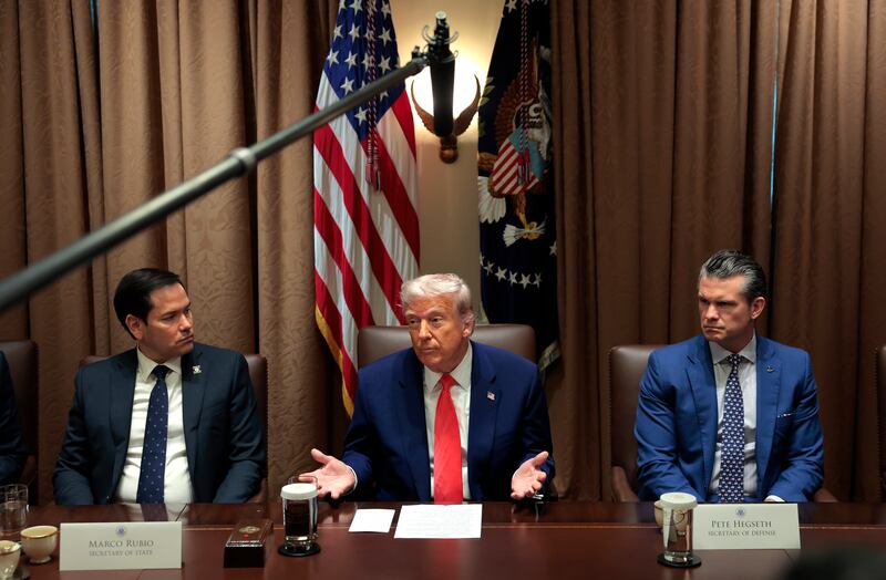 U.S. President Donald Trump (C) delivers remarks alongside Secretary of State Marco Rubio (L) and Secretary of Defense Pete Hegseth during a Cabinet meeting at the White House on April 10, 2025 in Washington, DC.