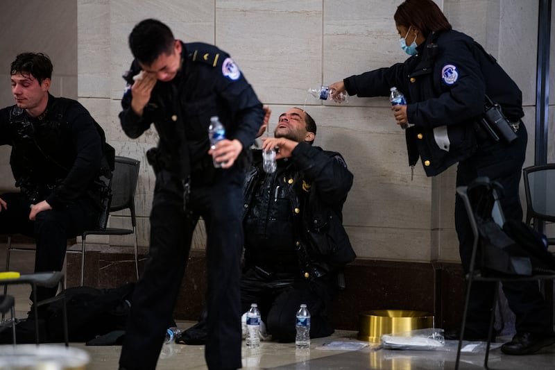 Capitol Police officers receive medical treatment in the crypt of the U.S. Capitol after clashes with protesters on January 6, 2021.