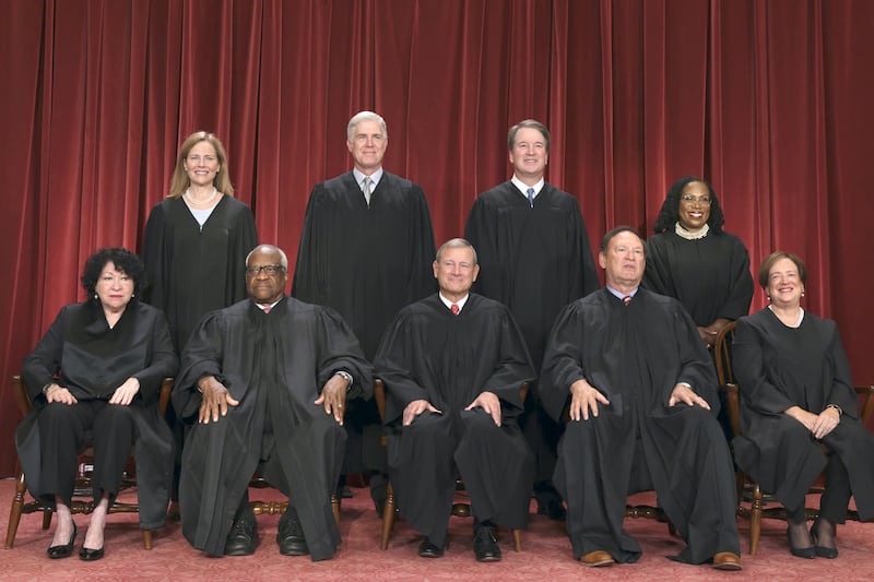 The nine Supreme Court justices seated in their robes.
