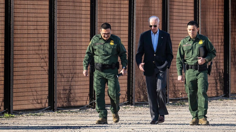 A photo including U.S. President Joe Biden with US Customs and Border Protection officers