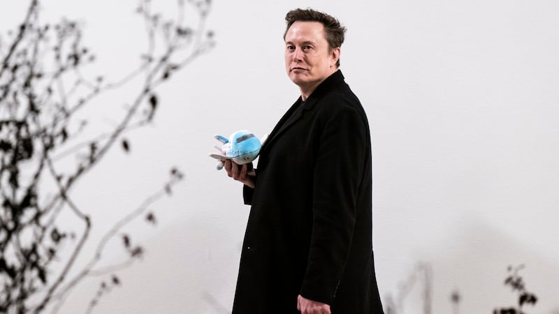 Washington, DC - February 19 : Elon Musk carries a stuffed Air Force One as he walks back to the West Wing along the colonnade after returning to the White House on Marine One with President Donald J Trump on Wednesday, Feb 19, 2025 in Washington, DC. (Photo by Jabin Botsford/The Washington Post via Getty Images)