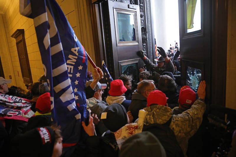 WASHINGTON, DC - JANUARY 06: Protesters supporting U.S. President Donald Trump break into the U.S. Capitol on January 06, 2021 in Washington, DC. Congress held a joint session today to ratify President-elect Joe Biden's 306-232 Electoral College win over President Donald Trump. Pro-Trump protesters entered the U.S. Capitol building during demonstrations in the nation's capital. (Photo by Win McNamee/Getty Images)