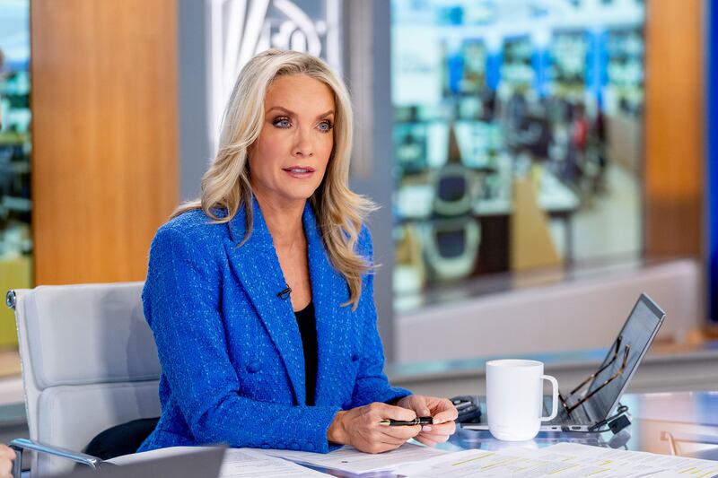 Dana Perino behind a news desk