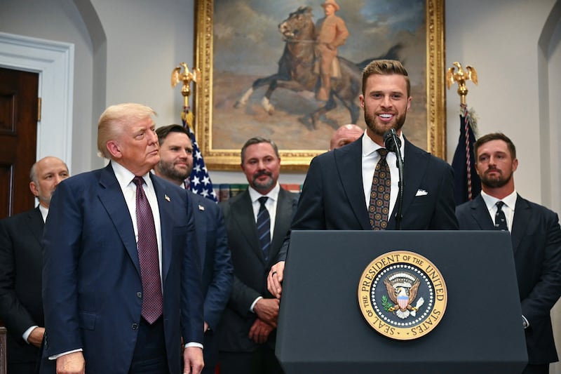 Harrison Butker next to Donald Trump