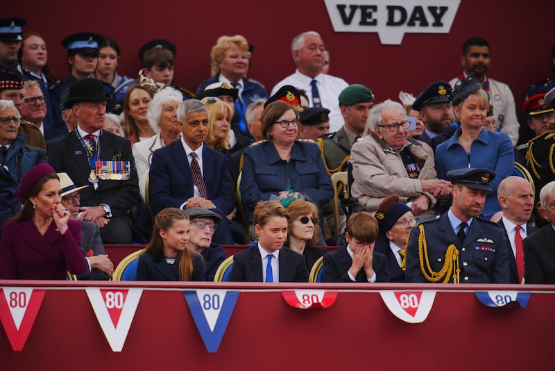 Prince George can't sit still at the anniversary of VE Day, in honour of those who served during the Second World War, at Buckingham Palace on May 5
