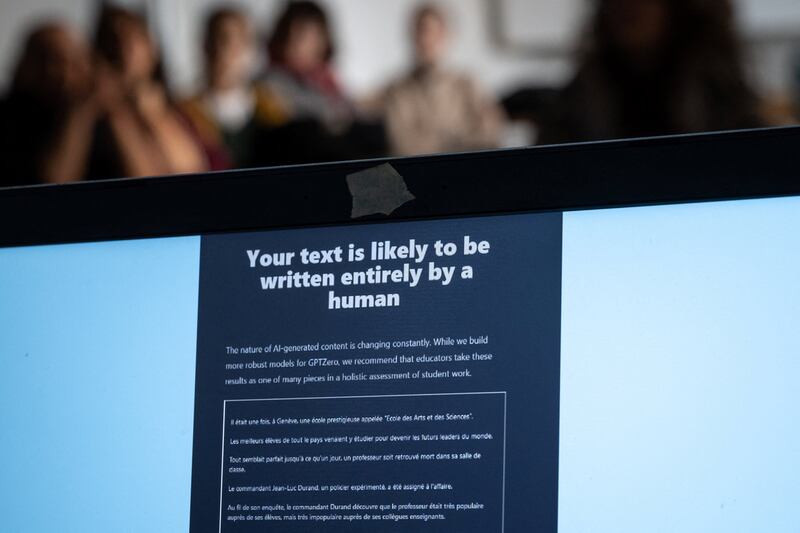 Teachers are seen behind a laptop during a workshop on ChatGpt bot organised for by the School Media Service (SEM) of the Public education of the Swiss canton of Geneva, on February 1, 2023.