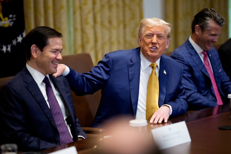 WASHINGTON, DC - JULY 08: (L-R) U.S. Secretary of State Marco Rubio laughs as U.S. President Donald Trump speaks, accompanied by U.S. Defense Secretary Pete Hegseth, tells a story about taking a clock from the State Department to decorate the Cabinet Room during a cabinet meeting at the White House on July 08, 2025 in Washington, DC. Trump discussed the recent flash flooding tragedy in Central Texas where at least 109 people have died, and other topics during the portion of the meeting that was open to members of the media. (Photo by Andrew Harnik/Getty Images)