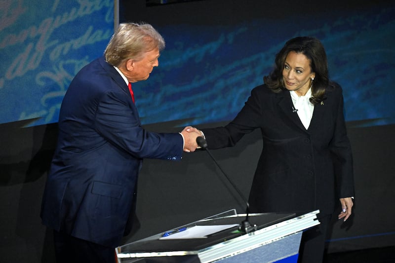 Kamala Harris (R) shakes hands with Donald Trump (L) during a presidential debate at the National Constitution Center in Philadelphia, Pennsylvania, on September 10, 2024.