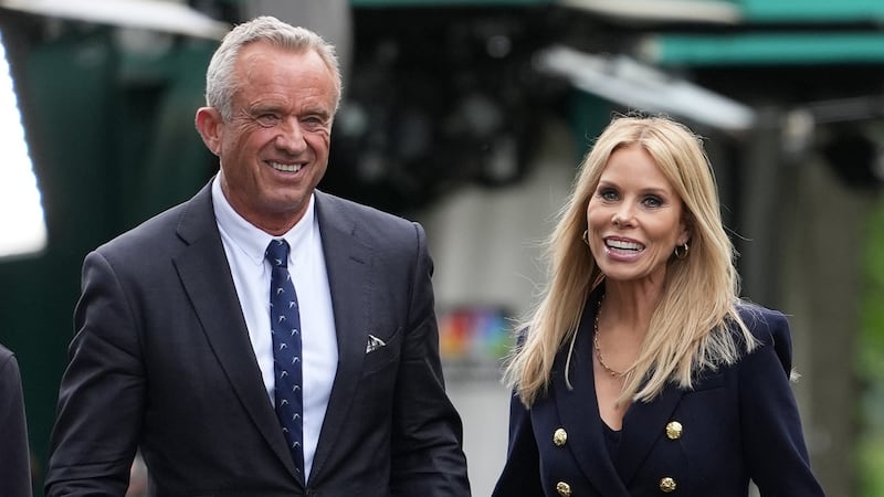 WASHINGTON, DC - MAY 22: Health and Human Services Secretary Robert F. Kennedy Jr. and his wife Cheryl Hines walk together at the White House on May 22, 2025 in Washington, DC. Kennedy was at the White House today to release a new Make America Healthy Again Commission report that blamed the rise in chronic illnesses on ultraprocessed foods, chemical exposures, lifestyle factors and excessive use of prescription drugs. (Photo by Kevin Dietsch/Getty Images)