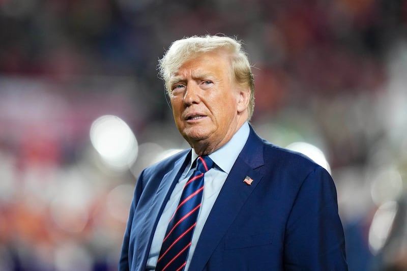 Former President Donald Trump looks on at half time of a game between the South Carolina Gamecocks and the Clemson Tigers.