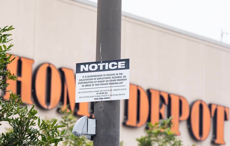 A Home Depot in Huntington Park, California, warns that soliciting work in its parking lot is a misdemeanor.