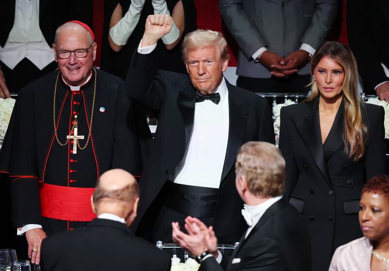Cardinal Timothy Dolan, President Donald Trump, and Melania Trump at the annual Alfred E. Smith Foundation Dinner in October 2024.