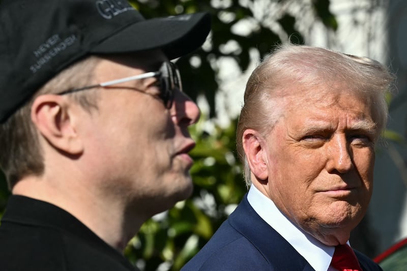 President Donald Trump (right) and Elon Musk speak to the press on the South Portico of the White House on March 11, 2025 in Washington, DC.