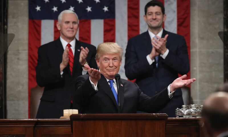 Then-President Donald Trump delivers the State of the Union address as US Vice President Mike Pence and Speaker of the House US Rep. Paul Ryan (R-WI) look on in the chamber of the US House of Representatives.