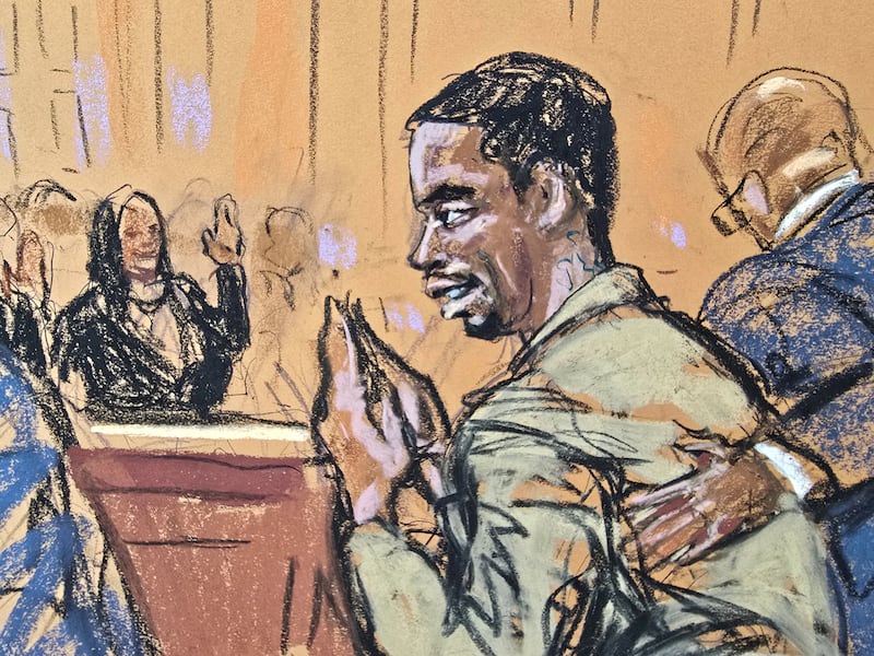Sean 'Diddy' Combs' bows and waves back to friends and family who wave at him as he attends a hearing in federal court in the Manhattan borough of New York City, U.S., October 10, 2024 in this courtroom sketch.