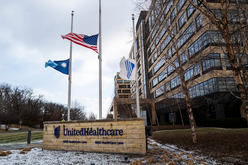 Flags fly at half mast outside the United Healthcare corporate headquarters on December 4, 2024 in Minnetonka, Minnesota after United Healthcare CEO Brian Thompson was shot dead on the street in New York City.