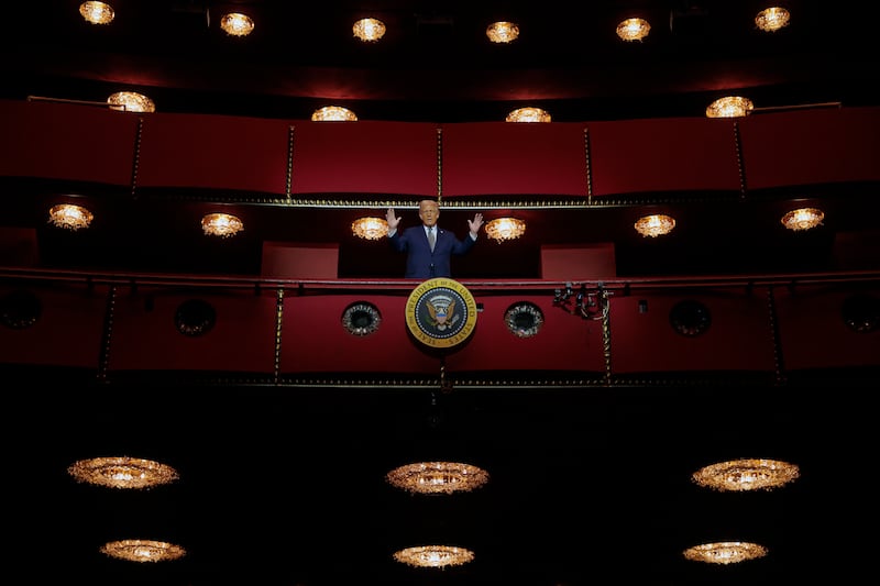 Trump looks down from the Presidential Box in the center's Opera House after a board meeting.
