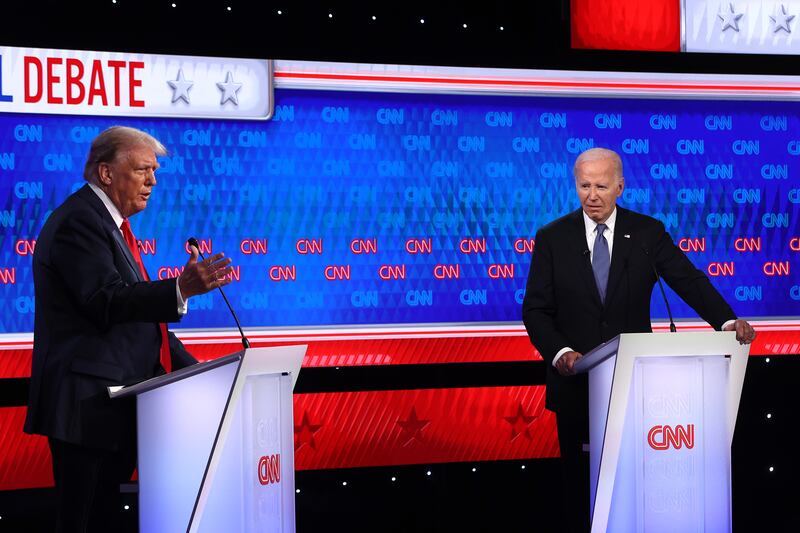 President Joe Biden (right) and former President Donald Trump participate in a presidential debate at CNN Studios on June 27, 2024 in Atlanta, Georgia.