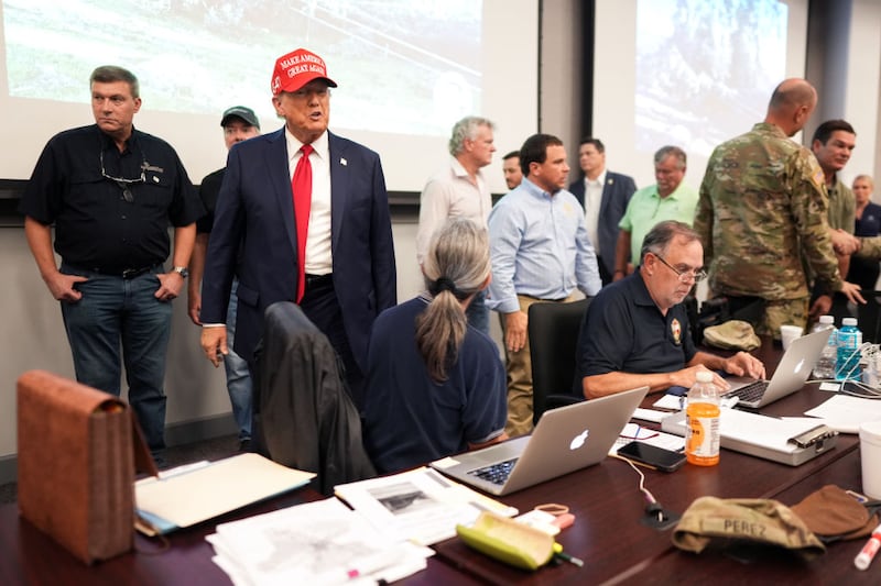 Former President Donald Trump is briefed by local officials about the damage from Hurricane Helene in Valdosta, Georgia.