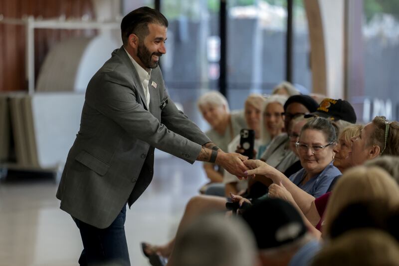 OCALA, FLORIDA - MARCH 26: Democratic nominee Josh Weil greets people during a campaign stop at the Silver Springs Shores Community Center on March 26, 2025 in Ocala, Florida. Polls show that Mr. Weil is within the margin of error in defeating Republican Randy Fine to flip National Security Advisor Mike Waltz's old seat in the U.S. House of Representatives. The race for the 6th district is one of two Florida Congressional special elections set for April 1st. (Photo by Joe Raedle/Getty Images)