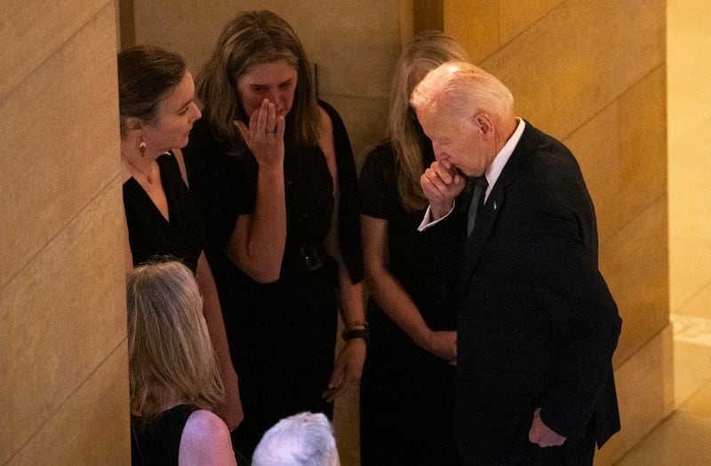 Former President Joe Biden speaks with a group after viewing the caskets of Rep. Melissa Hortman, her husband Mark Hortman, and their dog Gilbert.