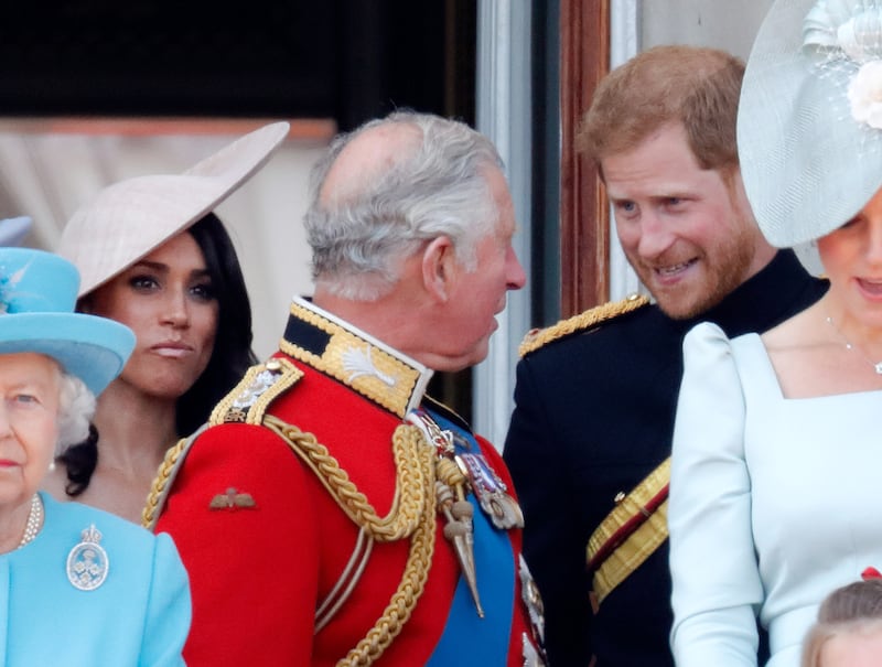 LONDON, UNITED KINGDOM - JUNE 09: (EMBARGOED FOR PUBLICATION IN UK NEWSPAPERS UNTIL 24 HOURS AFTER CREATE DATE AND TIME) Meghan, Duchess of Sussex, Prince Charles, Prince of Wales and Prince Harry, Duke of Sussex stand on the balcony of Buckingham Palace during Trooping The Colour 2018 on June 9, 2018 in London, England.