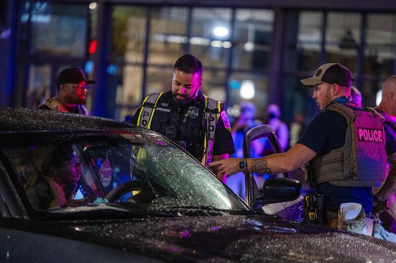 WASHINGTON, DC - AUGUST 13: Washington DC Metro Police officers question a driver at a roadside checkpoint on 14th street Northwest on August 13, 2025 in Washington, DC. U.S. President Donald Trump announced plans to deploy federal officers and the National Guard to the District in order to place the DC Metropolitan Police Department under federal control and assist in crime prevention in the nation's capital. (Photo by Tasos Katopodis/Getty Images)