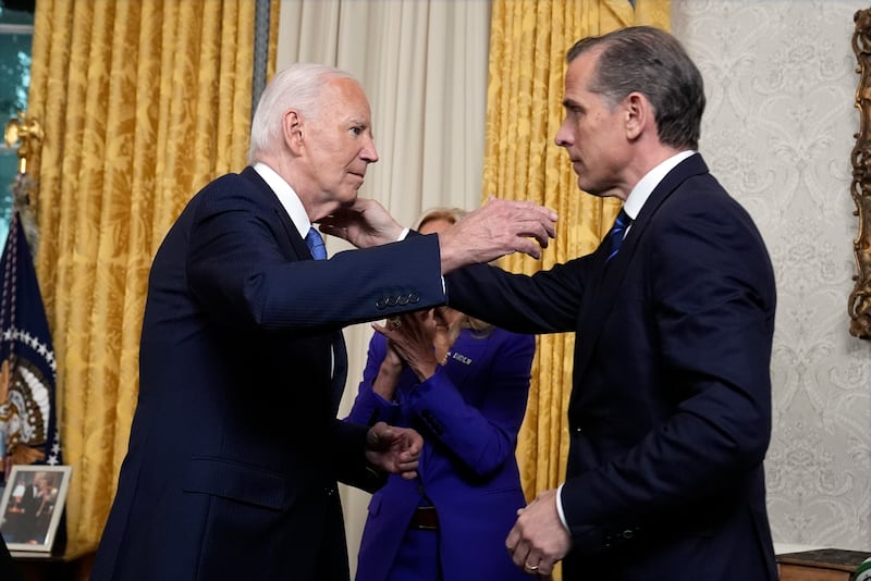 President Joe Biden hugs son Hunter Biden after addressing the nation from the Oval Office of the White House on July 24, 2024 in Washington, DC.