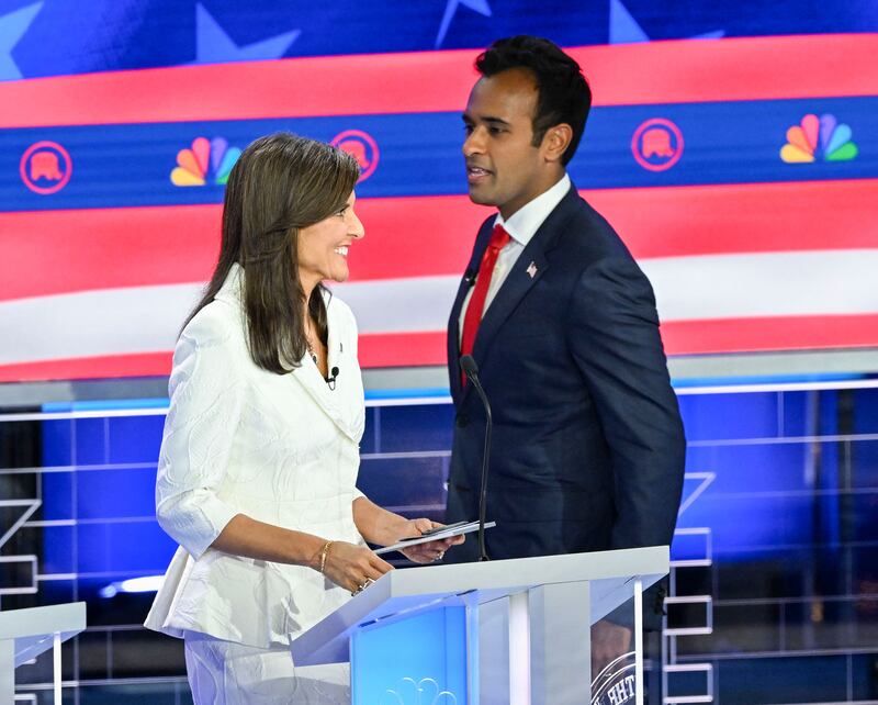 A picture of Nikki Haley and Vivek Ramaswamy looking at each other at the Republican Presidential Debate.