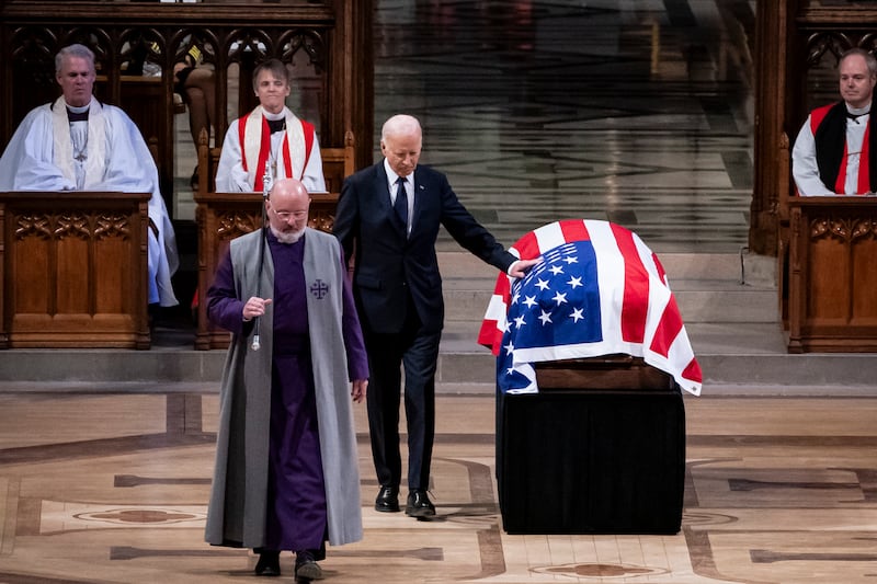 US President Joe Biden touches the casket after delivering the eulogy at the State Funeral Service for former US President Jimmy Carter at the Washington National Cathedral in Washington, DC, on January 9, 2025. (Photo by Haiyun Jiang / POOL / AFP) (Photo by HAIYUN JIANG/POOL/AFP via Getty Images)