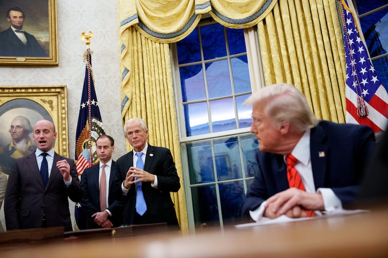 Aides Stephen Miller, Will Scharf, Peter Navarro alongside Donald Trump.