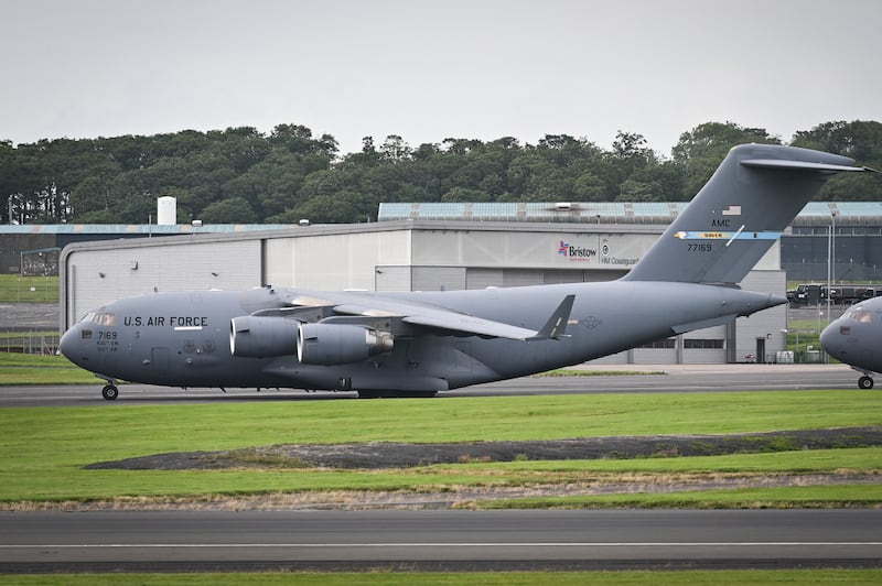 U.S. Air Force planes parked on the tarmac at Prestwick airport, south of Glasgow in Scotland, ahead of Trump’s arrival on July 25—a Secret Service agent allegedly tried to bring their wife, a member of the Air Force, onto one of the support flights.