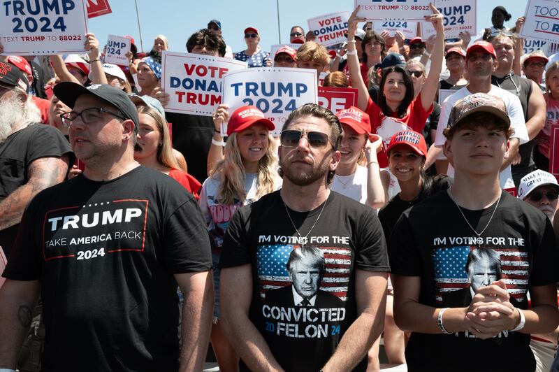 People attend a campaign rally hosted by Republican presidential candidate former President Donald Trump at Festival Park on June 18, 2024 in Racine, Wisconsin