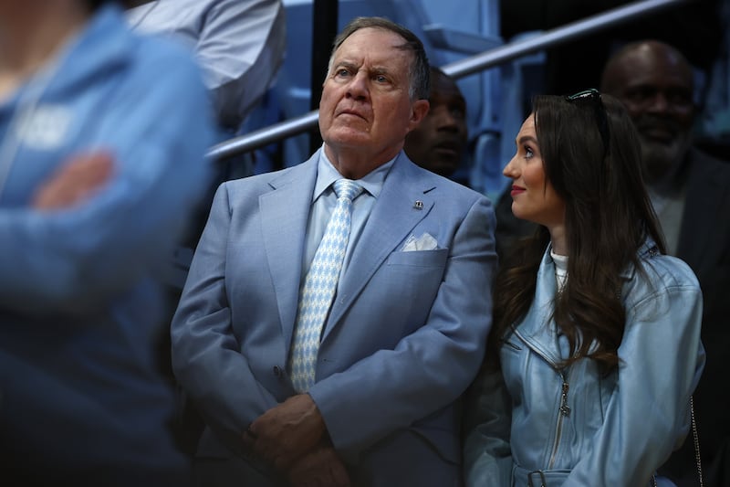 Bill Belichick and his girlfriend Jordon Hudson look on during the first half of the game between the North Carolina Tar Heels and the Duke Blue Devils at Dean E. Smith Center on March 8.