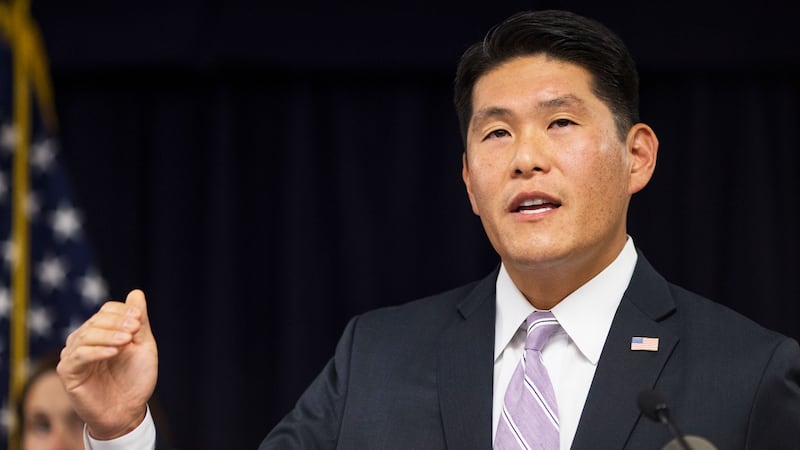A photo including United States Attorney Robert Hur