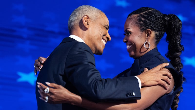 Barack and Michelle Obama appear on stage at the 2024 Democratic National Convention in Chicago.